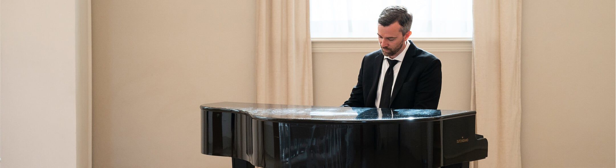 gentleman playing piano close-up