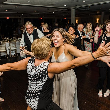 two woman dancing on dance floor close-up