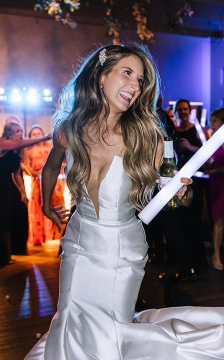 bride smiling for portrait on dance floor