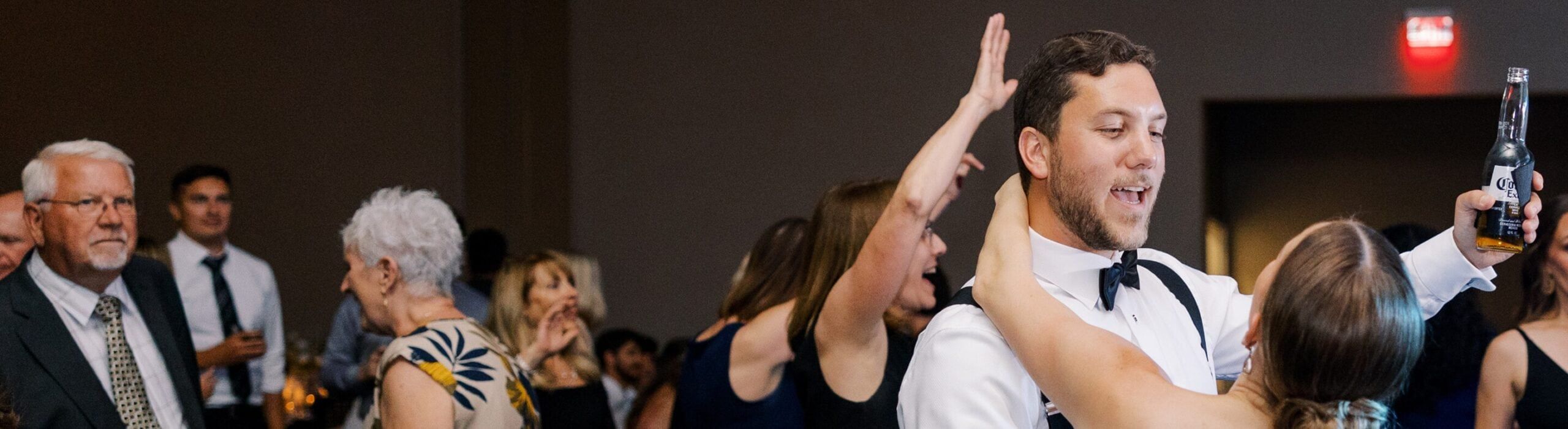 group of people dancing at wedding