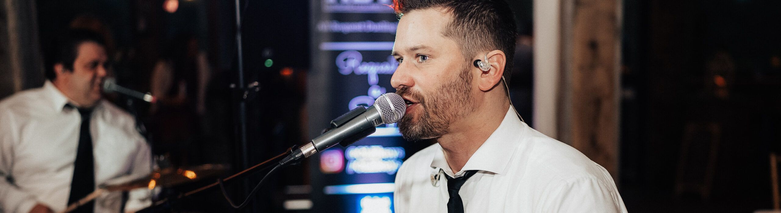 close-up of gentleman speaking into microphone