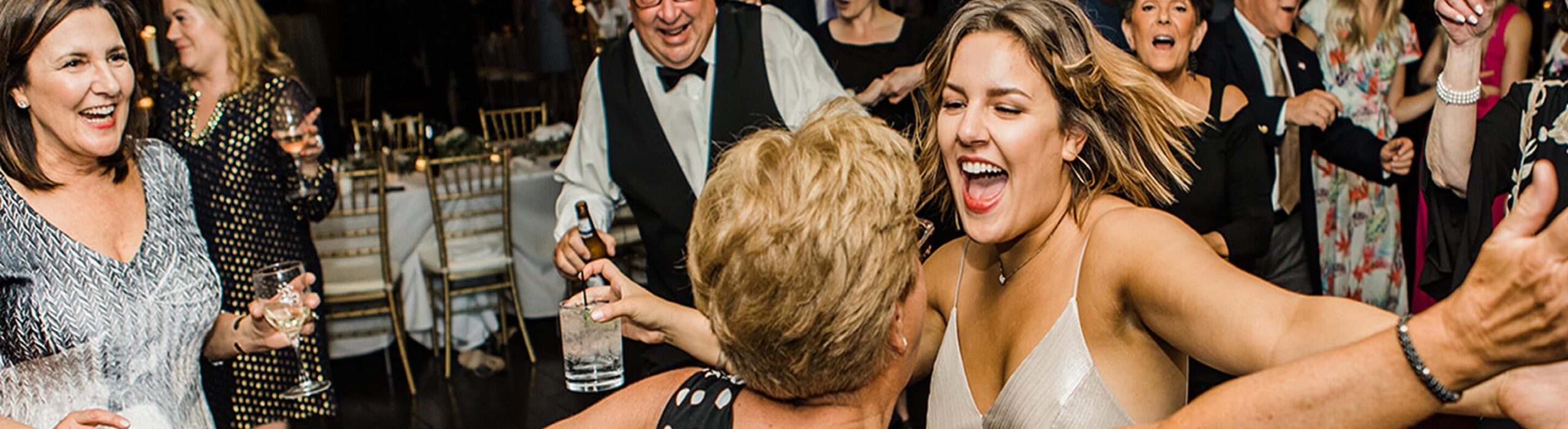 close-up of bride and mother dancing on dance floor
