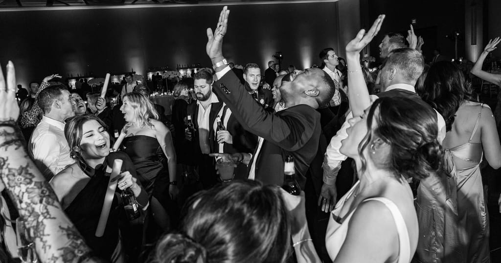 close-up of groom dancing in black and white