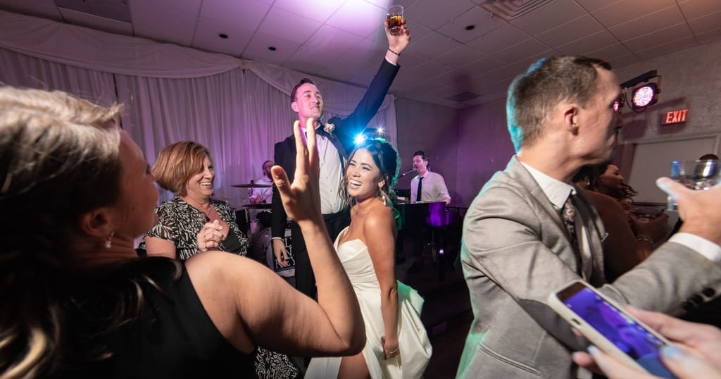 close-up of bride and groom celebrating at their wedding