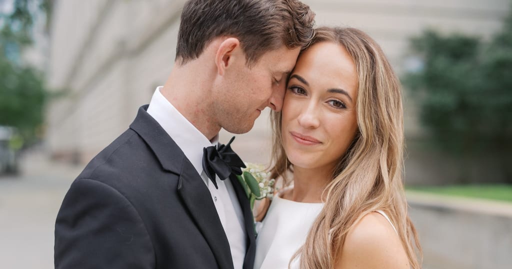 bride and groom posing for portrait close-up
