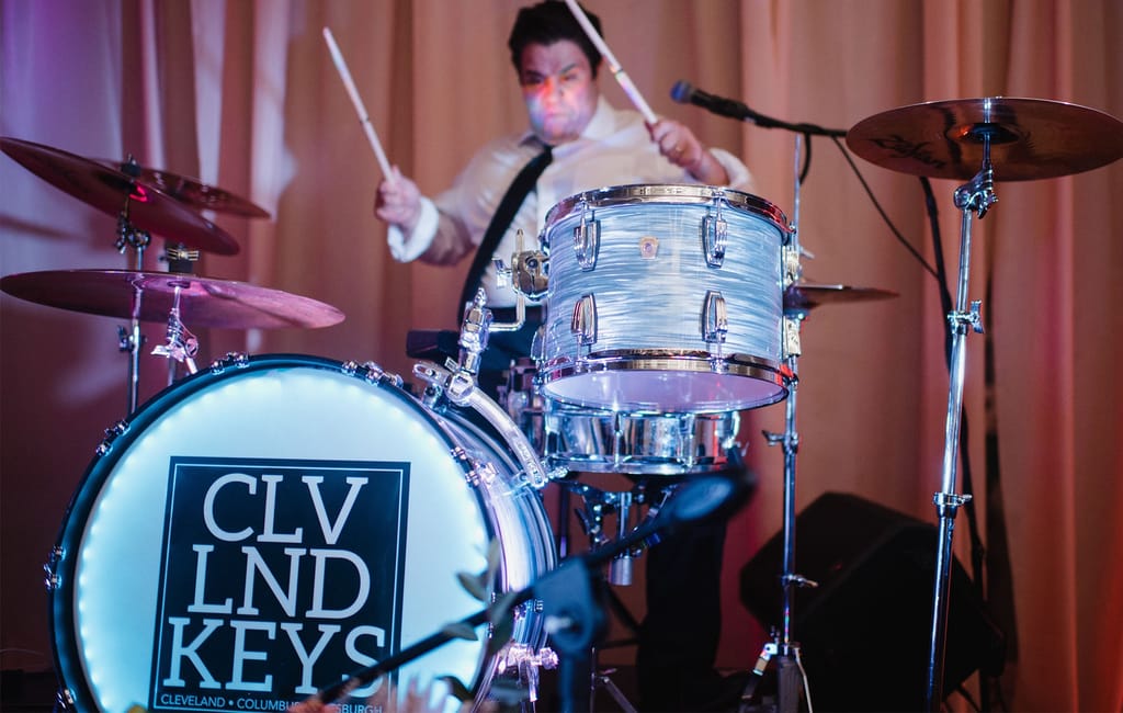 close-up of gentleman playing the drums at event