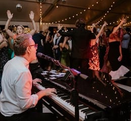 gentleman playing piano at event