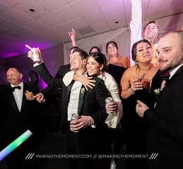 group of guests dancing at event
