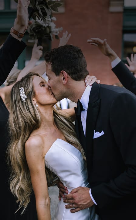 bride and groom kissing close-up
